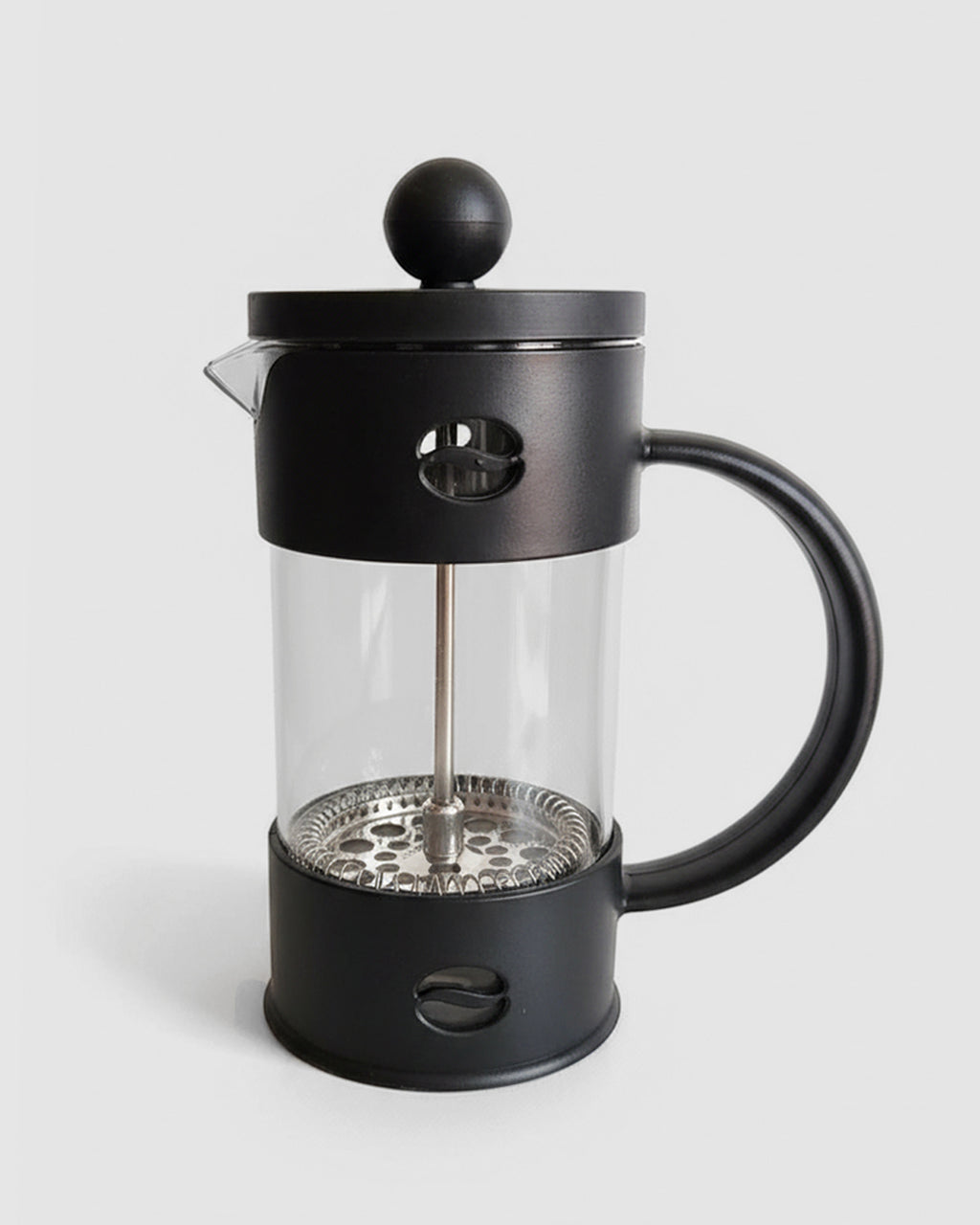 Prensa francesa negra con estructura protectora fija. Cafetera de émbolo con vaso de vidrio y carcasa de plástico resistente. Diseño moderno y seguro.